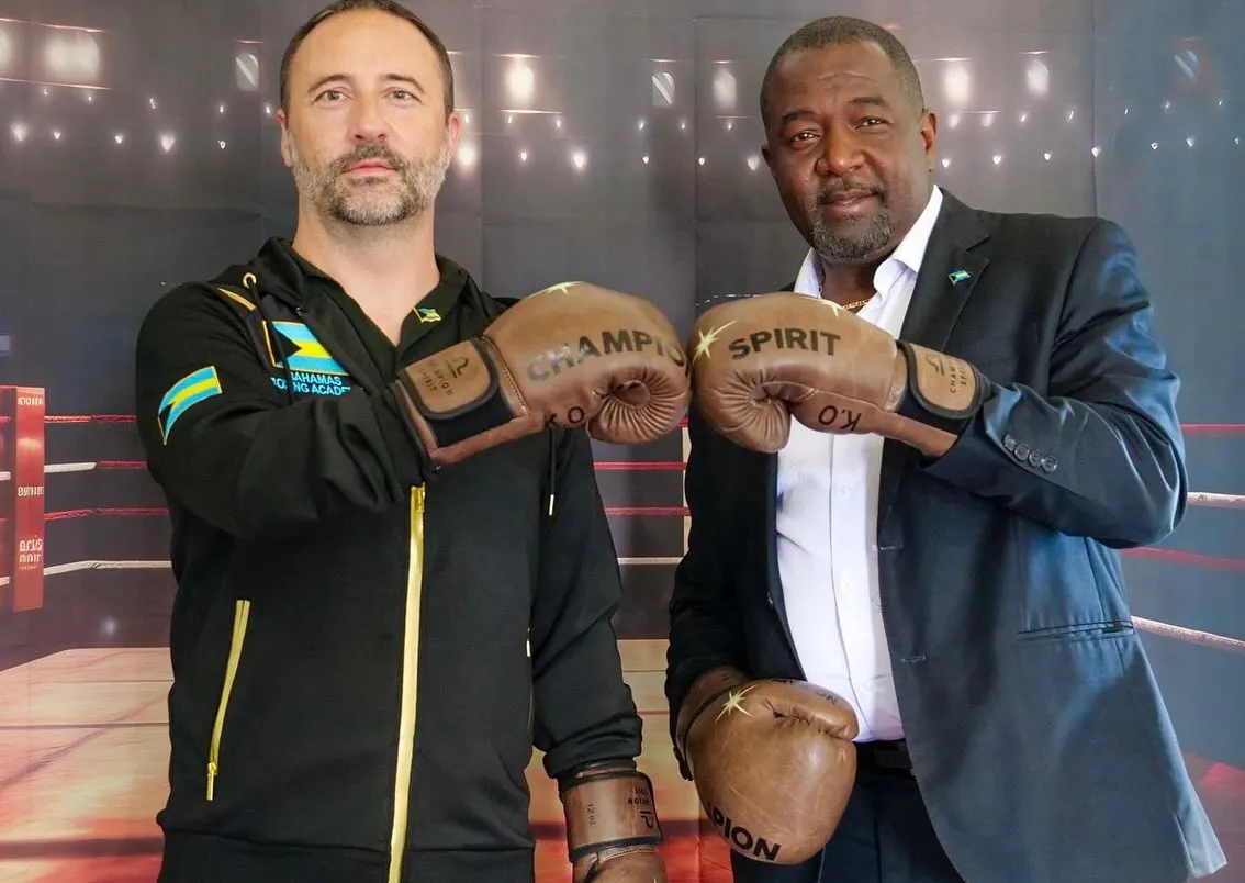 Nick Maughan and Mario Bowleg touching boxing gloves at the Bahamas Boxing Academy