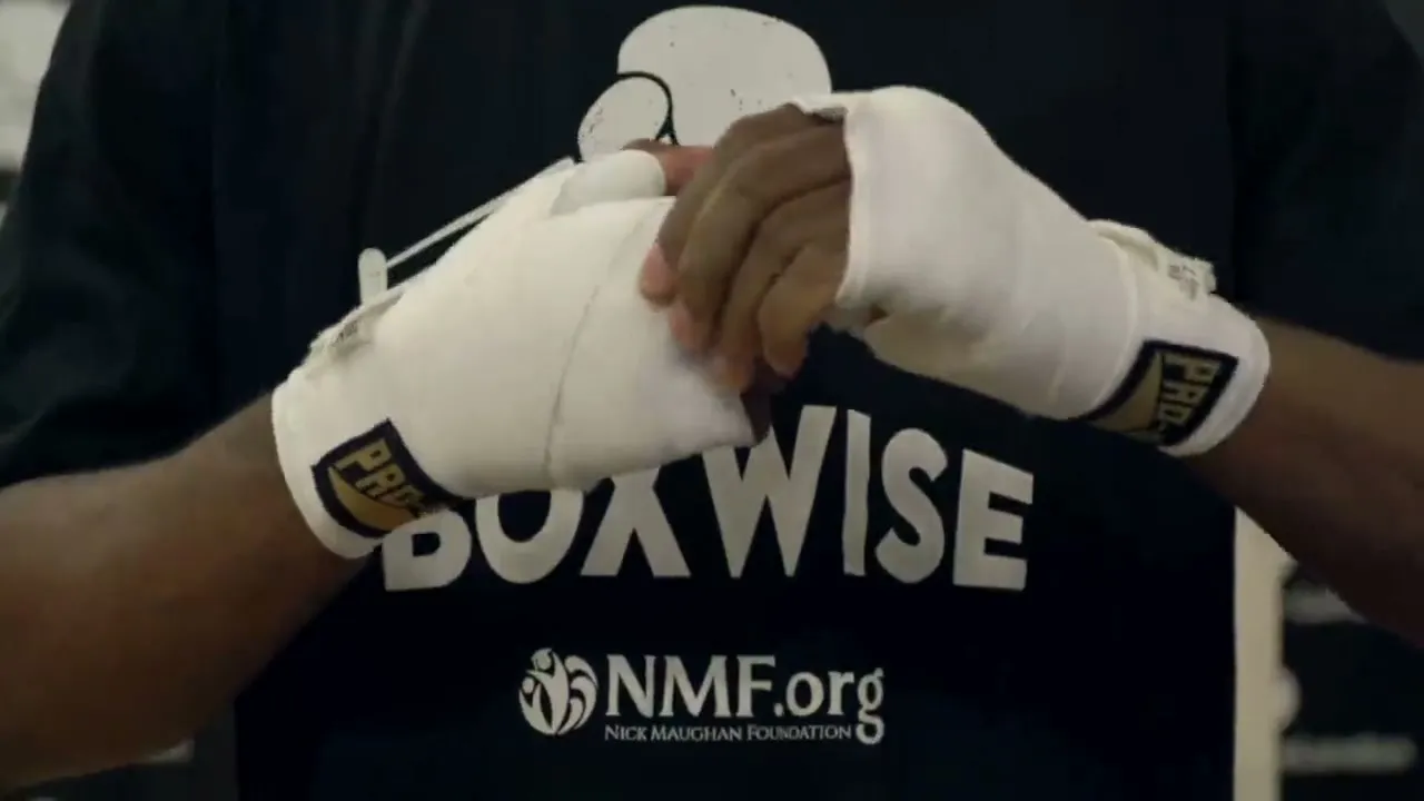 Taped hands on a BoxWise shirt