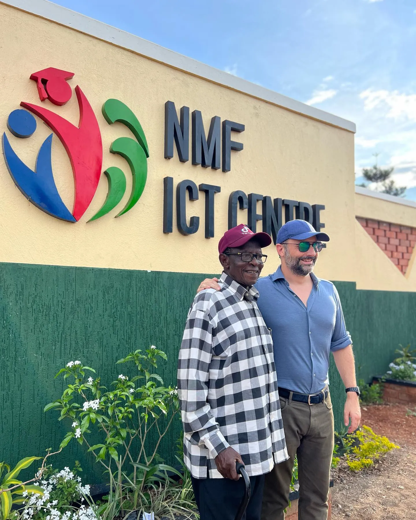 Nick Maughan at the NMF ICT Centre sign